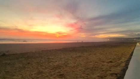 Cinematic-wide-angle-shot-of-beach-sand-and-golden-sunrise-sunset-at-the-beach-in-Playa-del-Carmen,-coastal-resort-town-Mexico