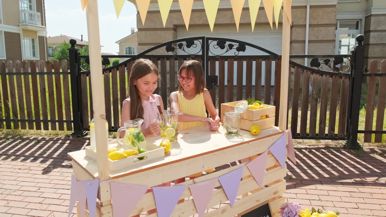 Cute Girls At Lemonade Stand In Summer