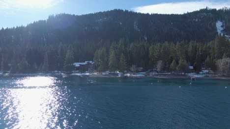 slow truck pan over lake tahoe on sunny winter day