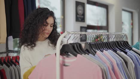 woman shopping for clothes in a retail store