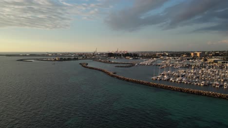 Aerial-view-of-Fremantle-Harbor-with-boats-at-sunset,-Western-Australia