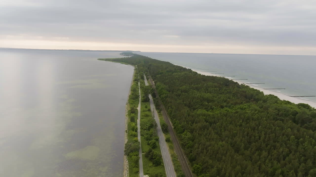Aerial view following the Hel Peninsula, gloomy, summer evening in Poland