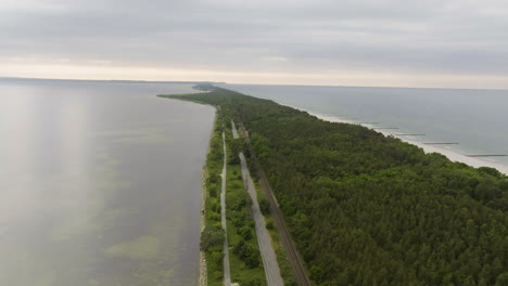 aerial view following the hel peninsula, gloomy, summer evening in poland