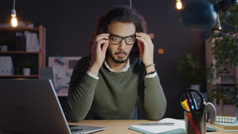 young man working late in office