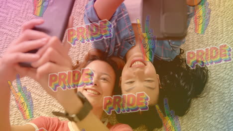 taking selfies, two smiling women with pride text and rainbow peace signs animation