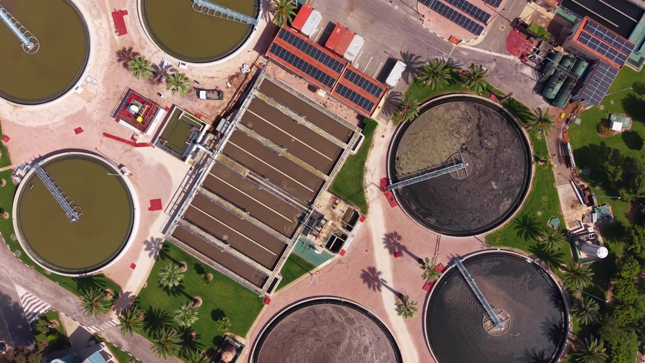 Modern wastewater treatment plant with circular clarifiers, aeration basins and biological treatment for nitrogen and phosphorus removal using activated sludge process