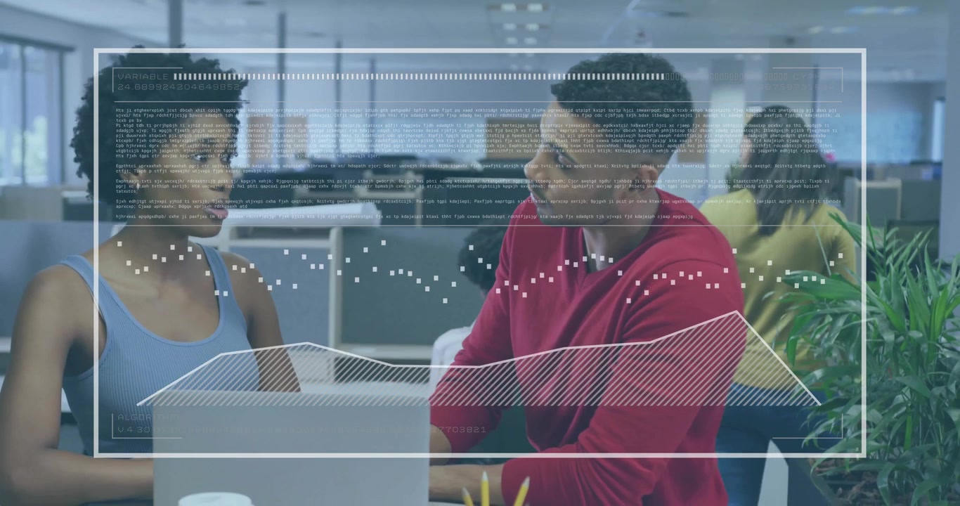 Coworkers reviewing laptop input initiating animated code and graph overlays in business office