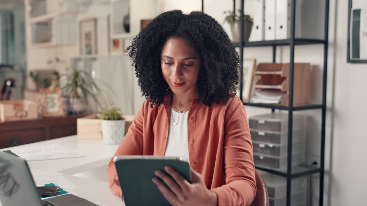 Woman working on a tablet in an office