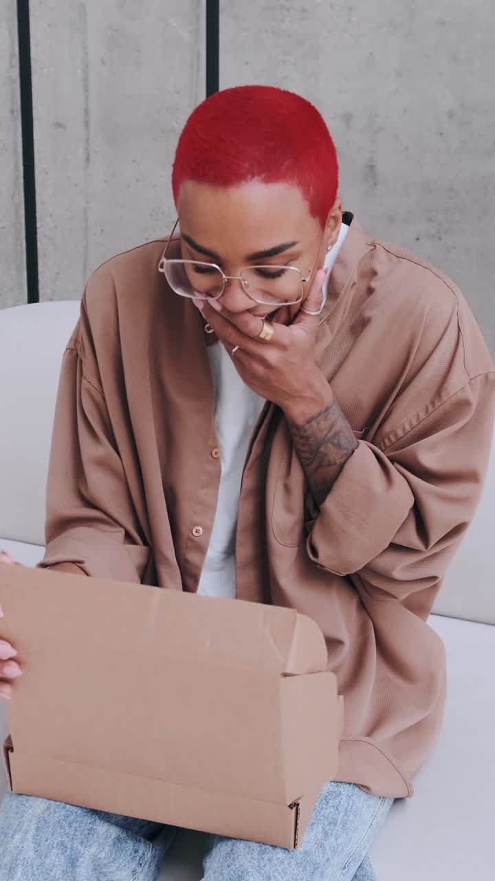 Unboxing an exciting package with vibrant style at a modern space