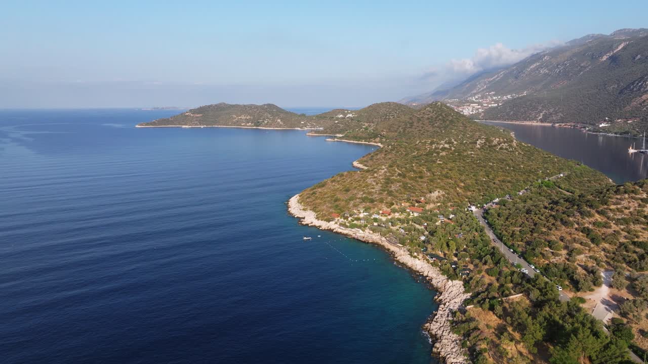Aerial panoramic dolly of Kas, Antalya, showing the town’s coastline, marina, with the Mediterranean waters
