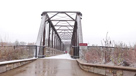 snow-covered bridge during fresh snowfall in winters-1
