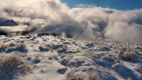 tilt up shot showing marvelous mountain landscape with mysterious clouds and sunlight in background