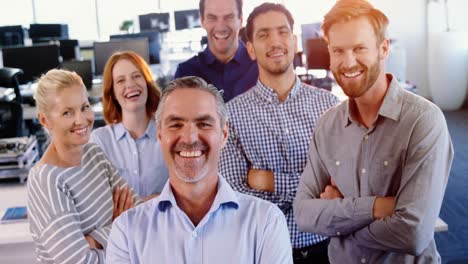 team of business executive standing with arms crossed