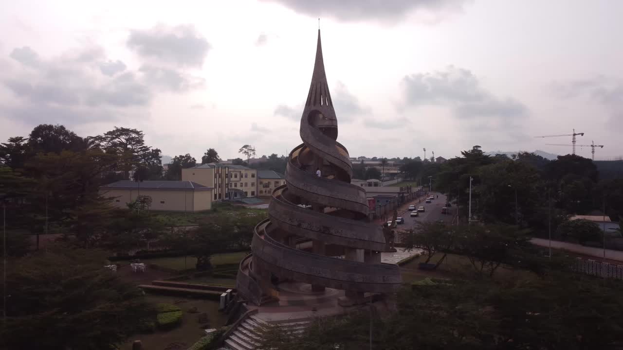 Side to side and rising 4k shot of the Reunification Monument Yaoundé, Cameroon.