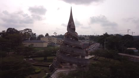 Side to side and rising 4k shot of the Reunification Monument Yaoundé, Cameroon.