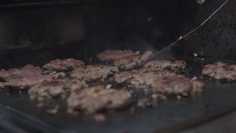 Frying-ground-beef-meat-on-a-grill-together-with-diced-onion