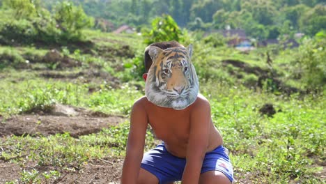 little boy with tiger mask