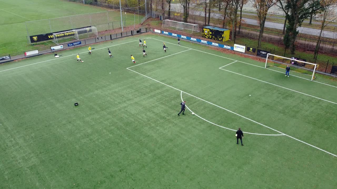Soccer players practicing on a field