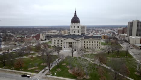 kansas state capitol building in topeka, kansas with drone video moving out medium shot