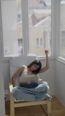woman working from home on a balcony