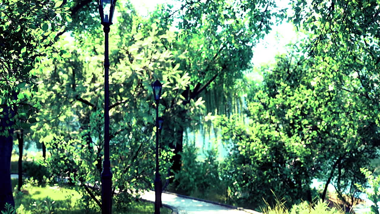 울창한 초록색으로 둘러싸인 조용한 길과 낮에 빈티지 스트리트 램프