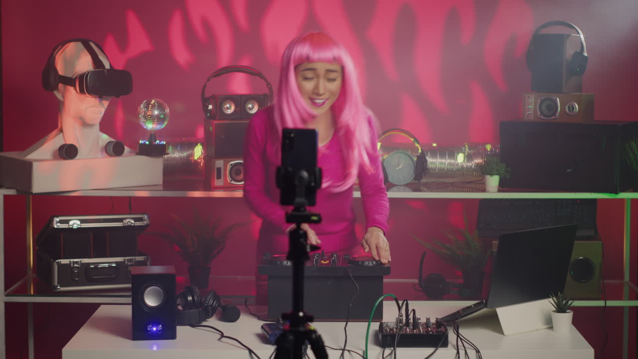 Woman with Pink Wig DJing in Studio
