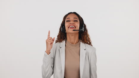 Call-center,-woman-and-pointing-up-with-headset