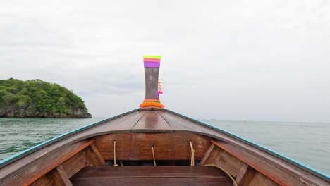 boat travels through ocean near krabi island