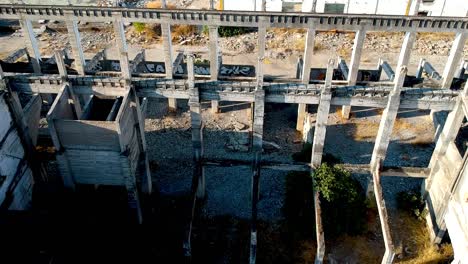 orbiting drone shot of the abandoned guadalquivir cement factory, seville, spain - aerial