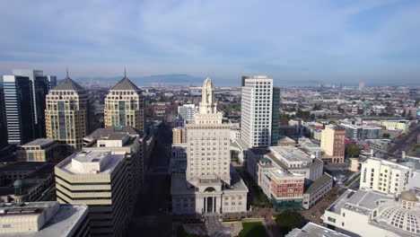 aerial view of oakland city hall and downtown buildings on sunny day, california usa, drone shot