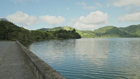 tracking shot on sete cidades bridge: blue lagoon, azores, são miguel