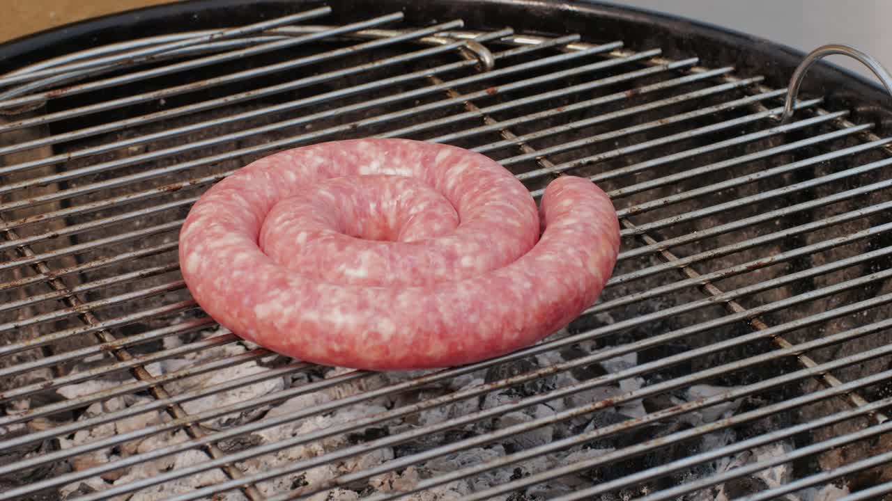 Traditional spanish barbeque, big sausage chorizo botifarra, pork and beef ribs on grill with fire, american style cooking, chef grilling meat fat food, steaks and sausages on bbq. High quality 4k footage