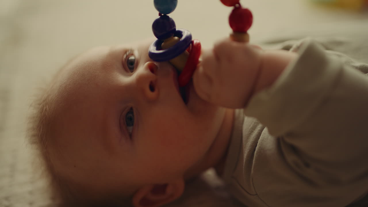 Close Up Baby Face Chewing Wooden Toy