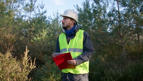 Nice-day-for-working-outdoors,-man-documenting-environmental-findings