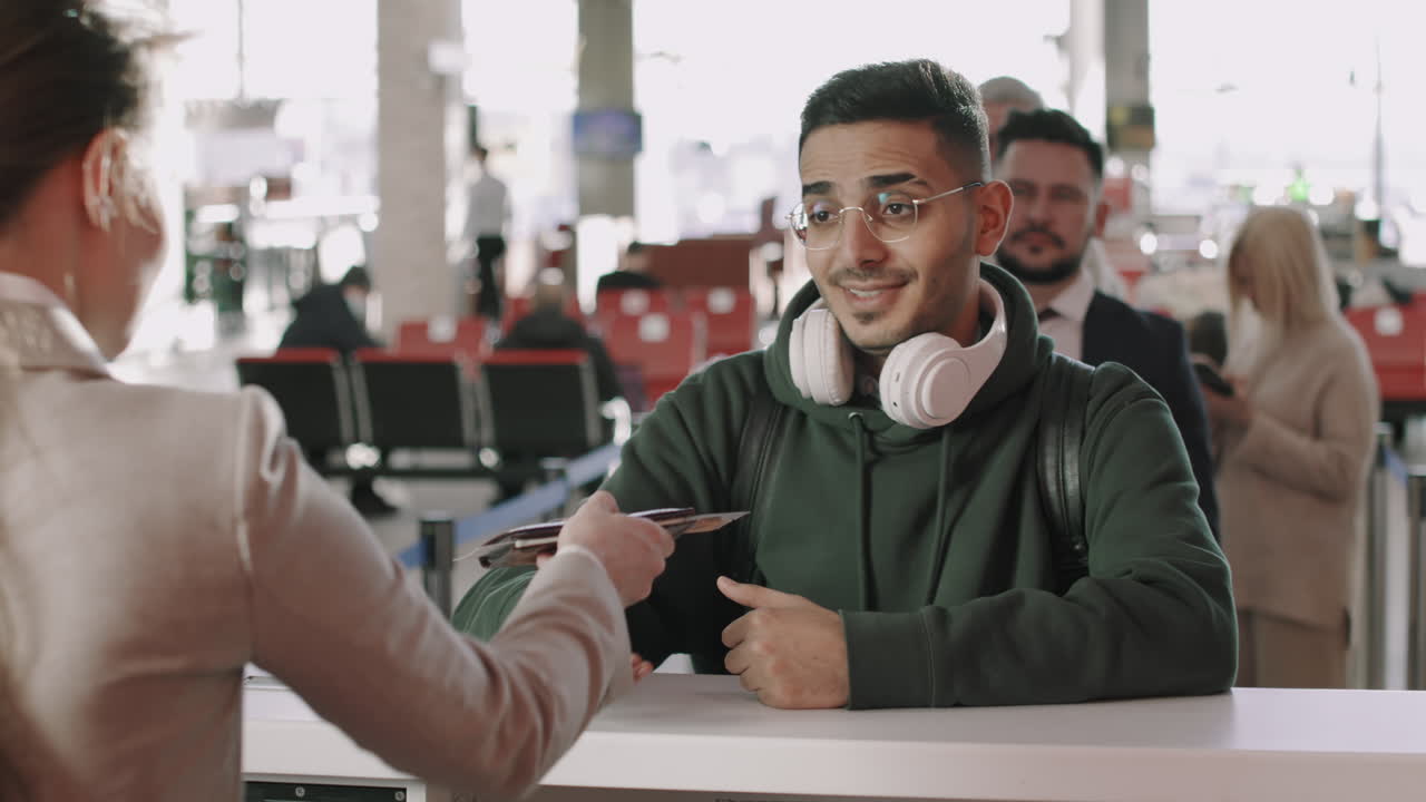 Multi-Ethnic People In Queue At Check-In