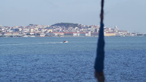 boat crossing lisbon river