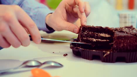 putting chocolate cake on plates