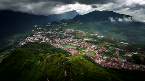 drone hyperlapse view from iconic dragon jaw mountain over mountainous town sapa