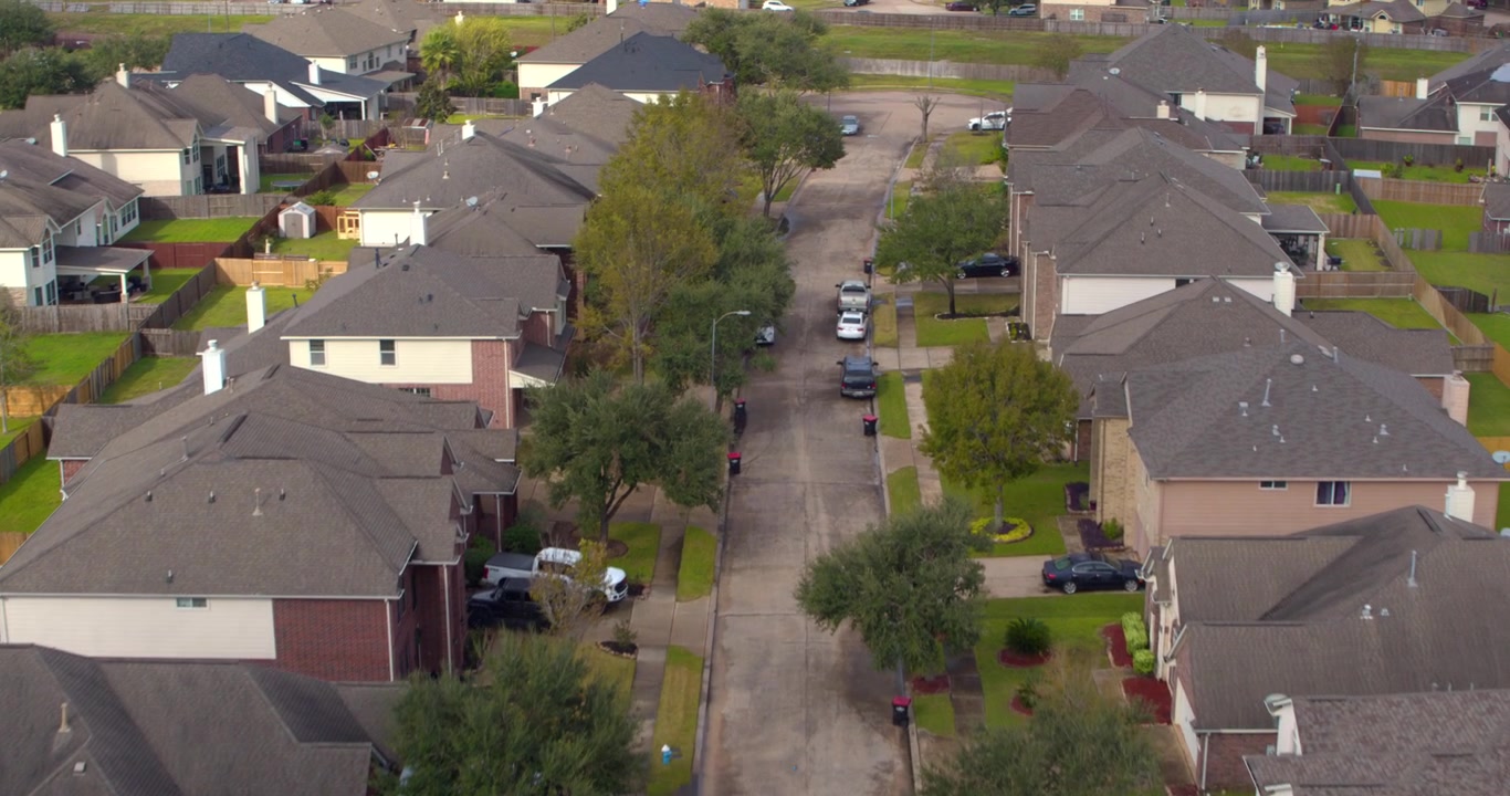 Drone view of suburban homes in Missouri City, Texas just outside of Houston