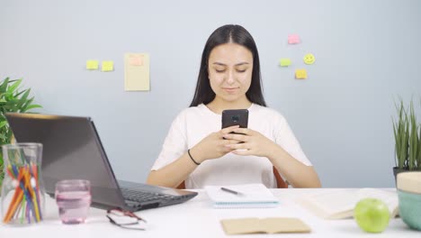 female student chatting on the phone.