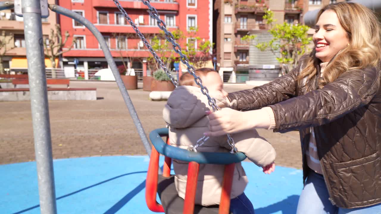 Mother and Child on a Swing Set