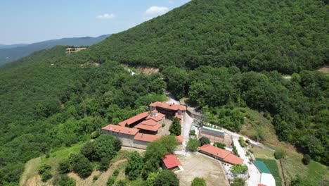 moni rentinas in agrafa mountains greece, aerial dolly shot, panoramic view of monastery and nearby forrest, nature landscape