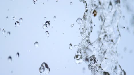 slow motion: water drop fall from eaves in close up