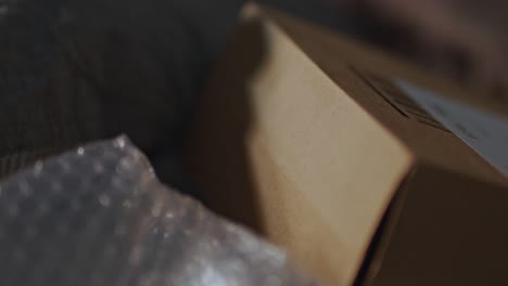 Close-shot-of-a-package-near-some-bubble-wrap-lean-somewhere