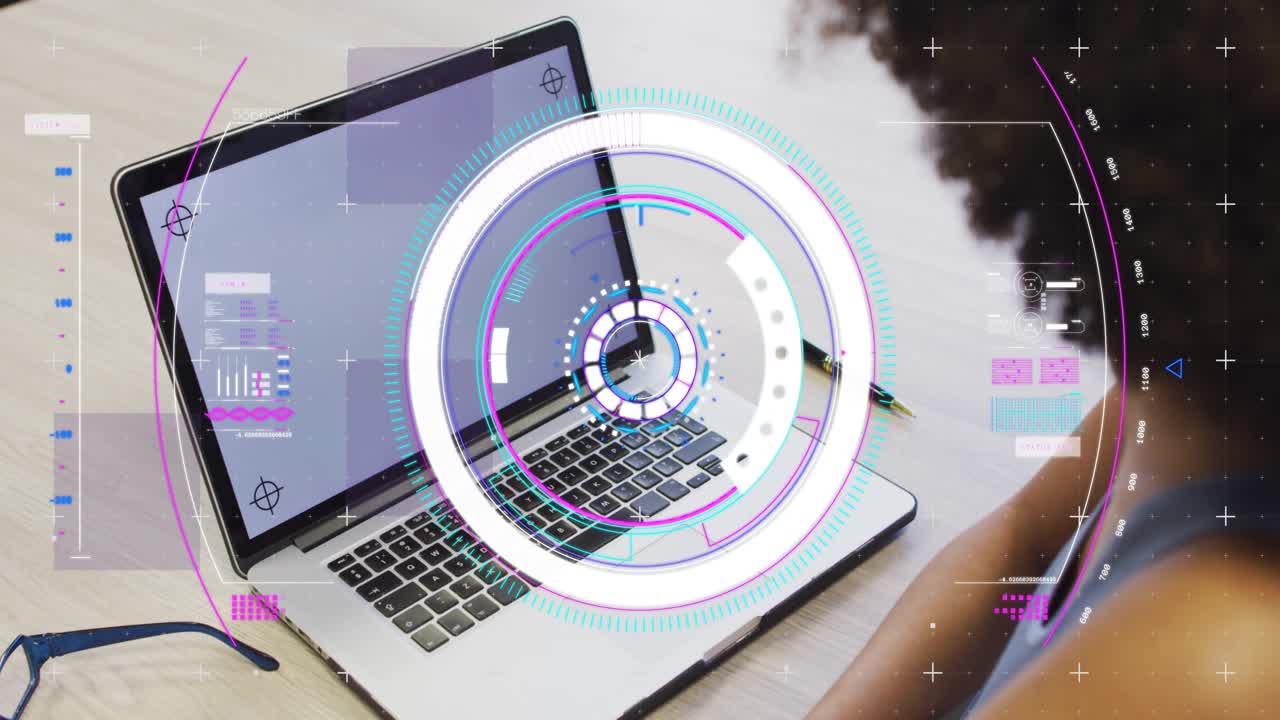 Woman seated at desk watching system starting and launching circular HUD over laptop for education