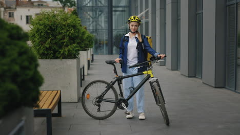 woman with bike outdoors