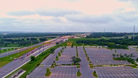 time laps drone footage of cars on the freeway early morning commute at sunrise