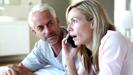 couple expecting a phone call and getting it