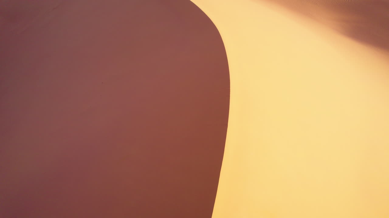 Flying over red sand dunes, red desert planet, Algeria - Aerial