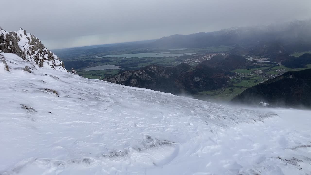 Snow being blown around on top of Breitenberg mountain in the Bavarian Alps close to Pfronten